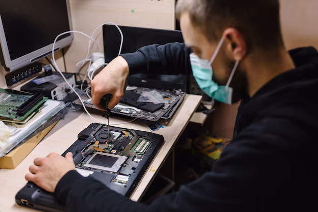 Technician working at a clean, well-organized repair bench